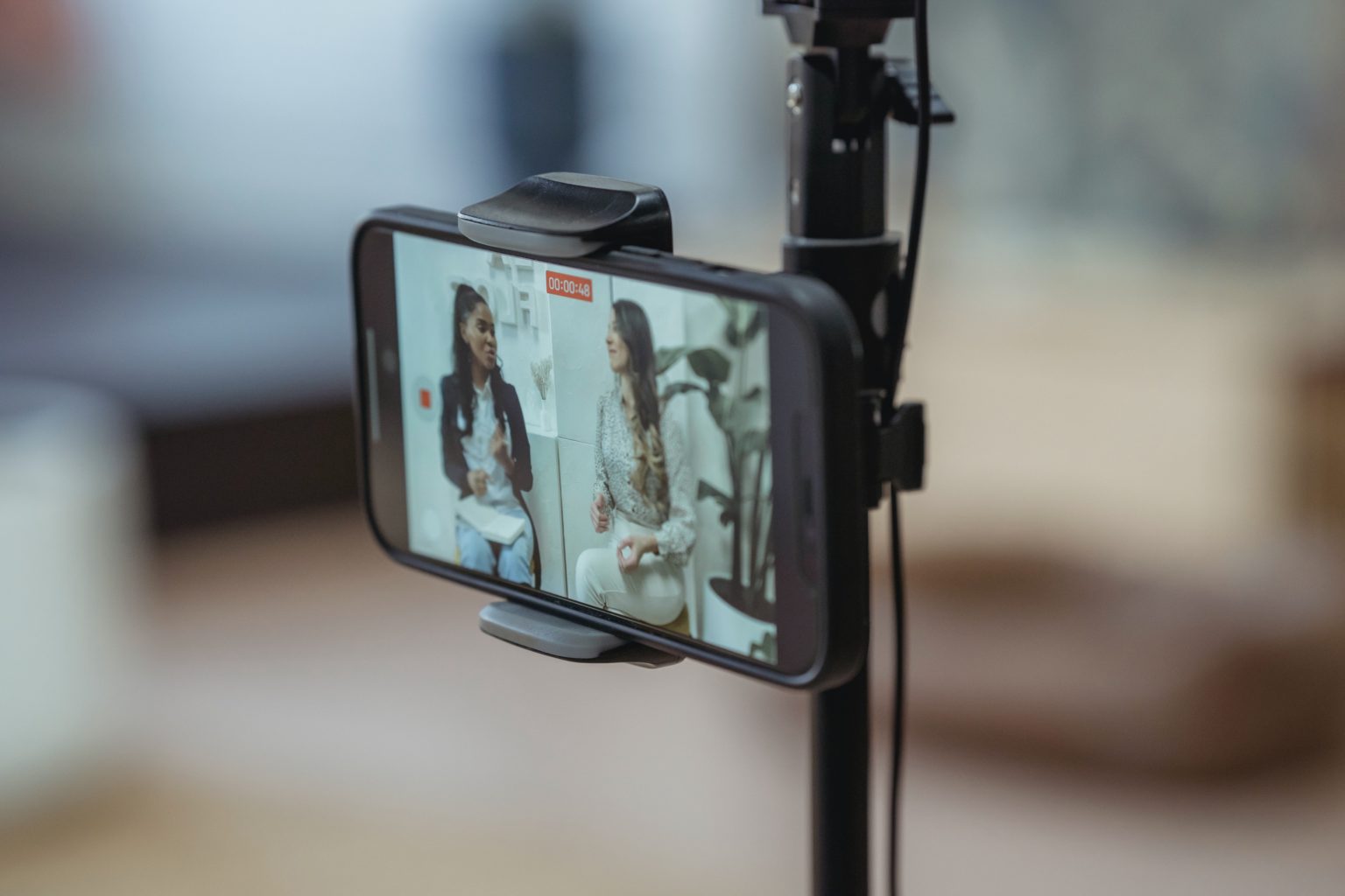 Two women film an internal communications video