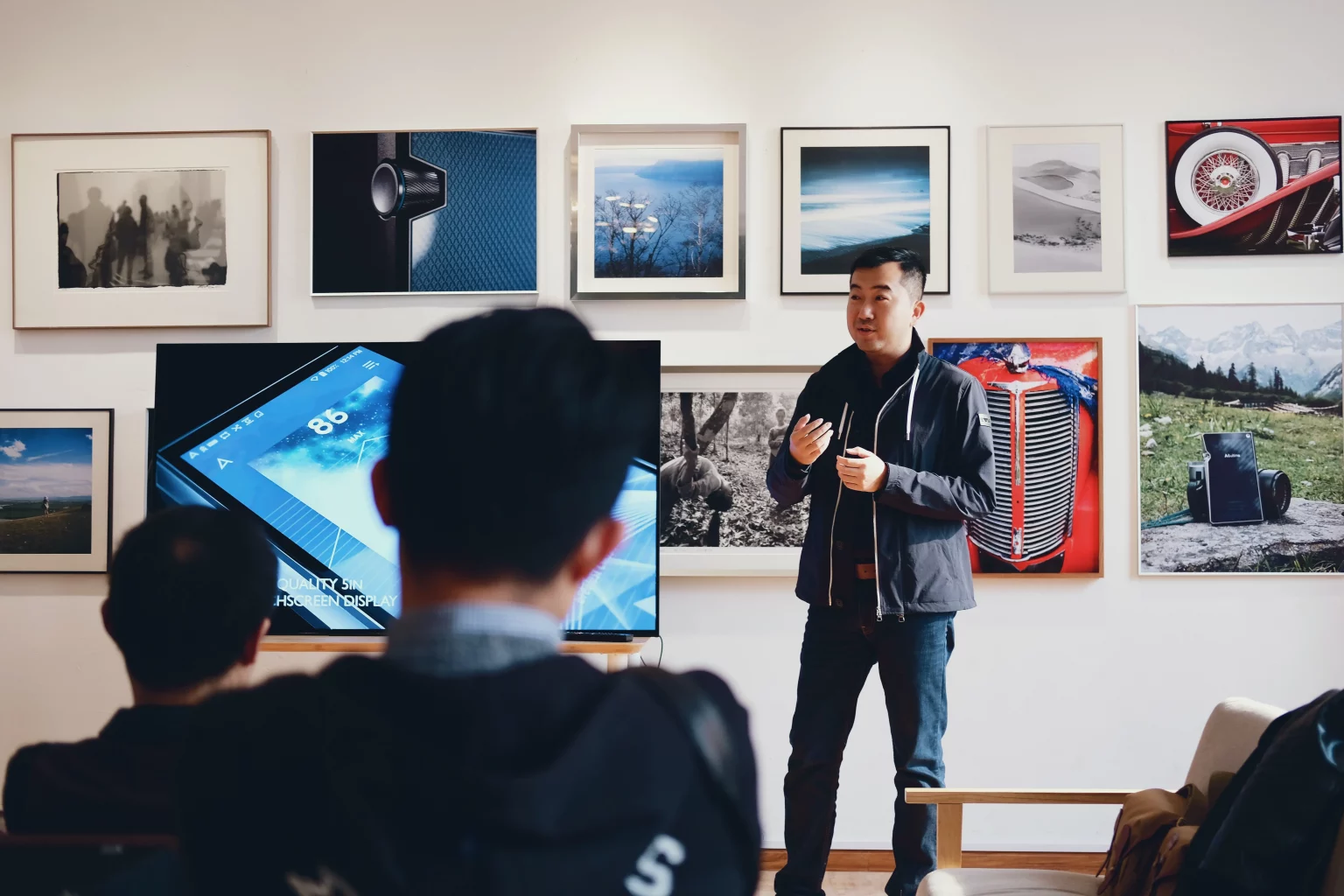 man standing by screen